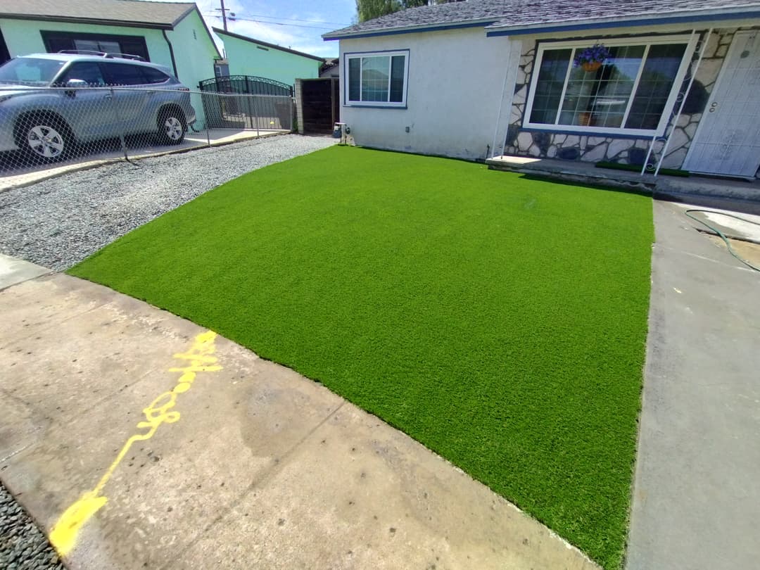 front yard with freshly installed artificial turf